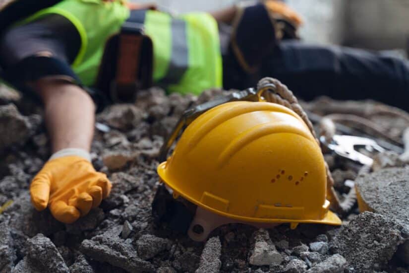 Construction Worker Laying Unconscious On The Ground
