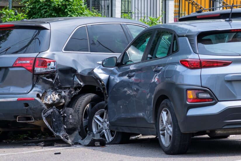 Two damaged gray SUVs after a car accident